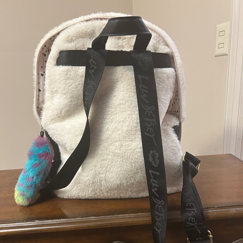 Betsey Johnson white and black backpack.